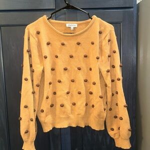 Stylish Mustard Sweater with Pom-Pom Accents